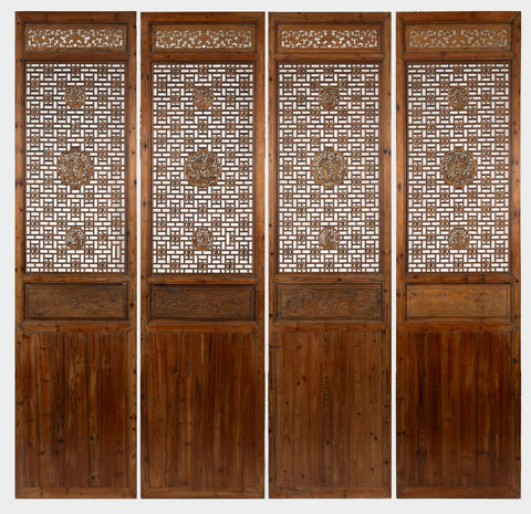 A Set of Four 19th Century Pierced Elm Panels
