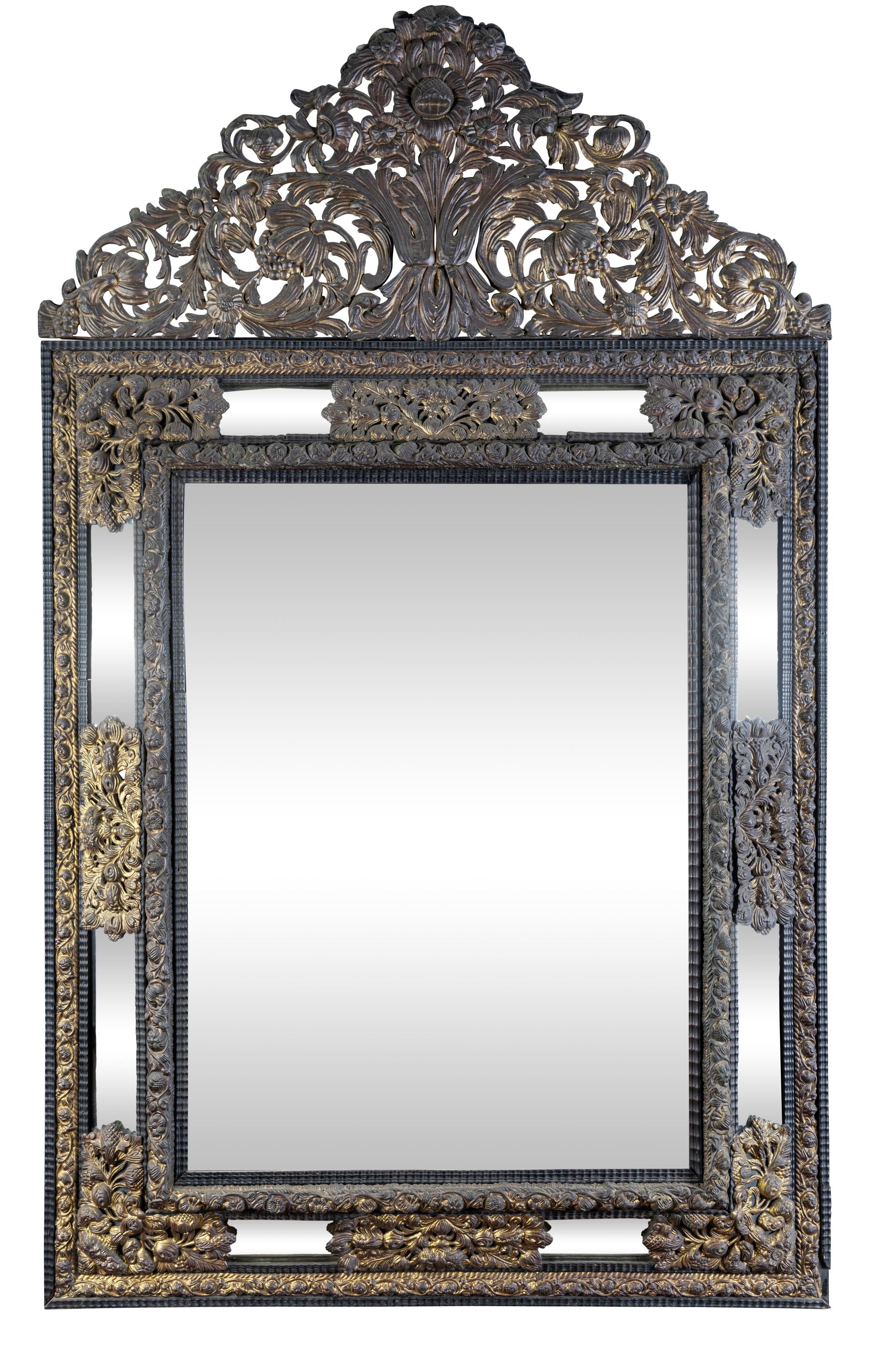A 19th Century Flemish Embossed Brass and Ebonised Cushion Fronted Mirror (GS 387)