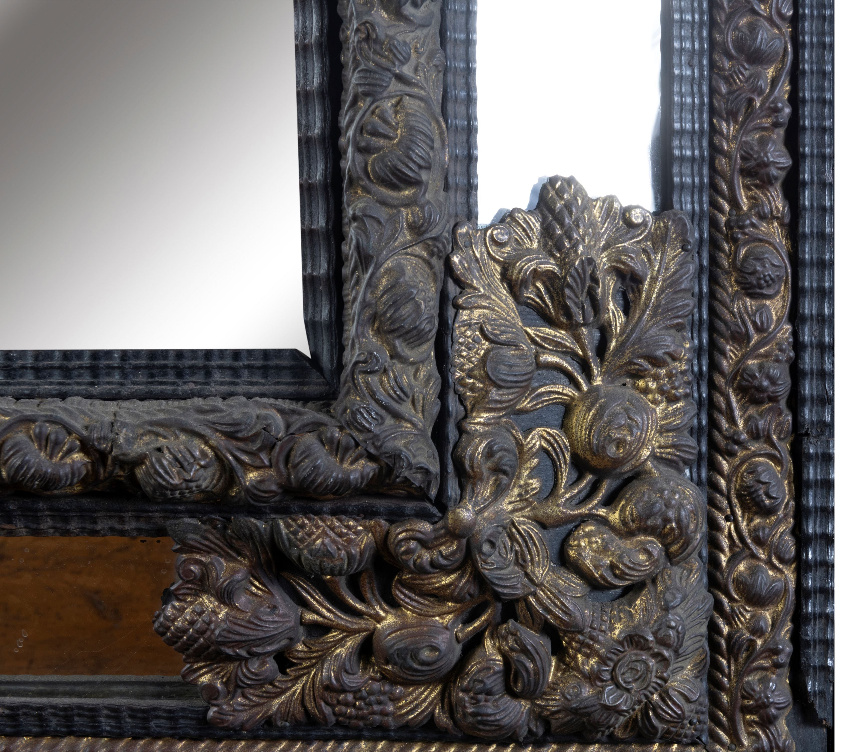 A 19th Century Flemish Embossed Brass and Ebonised Cushion Fronted Mirror (GS 387)