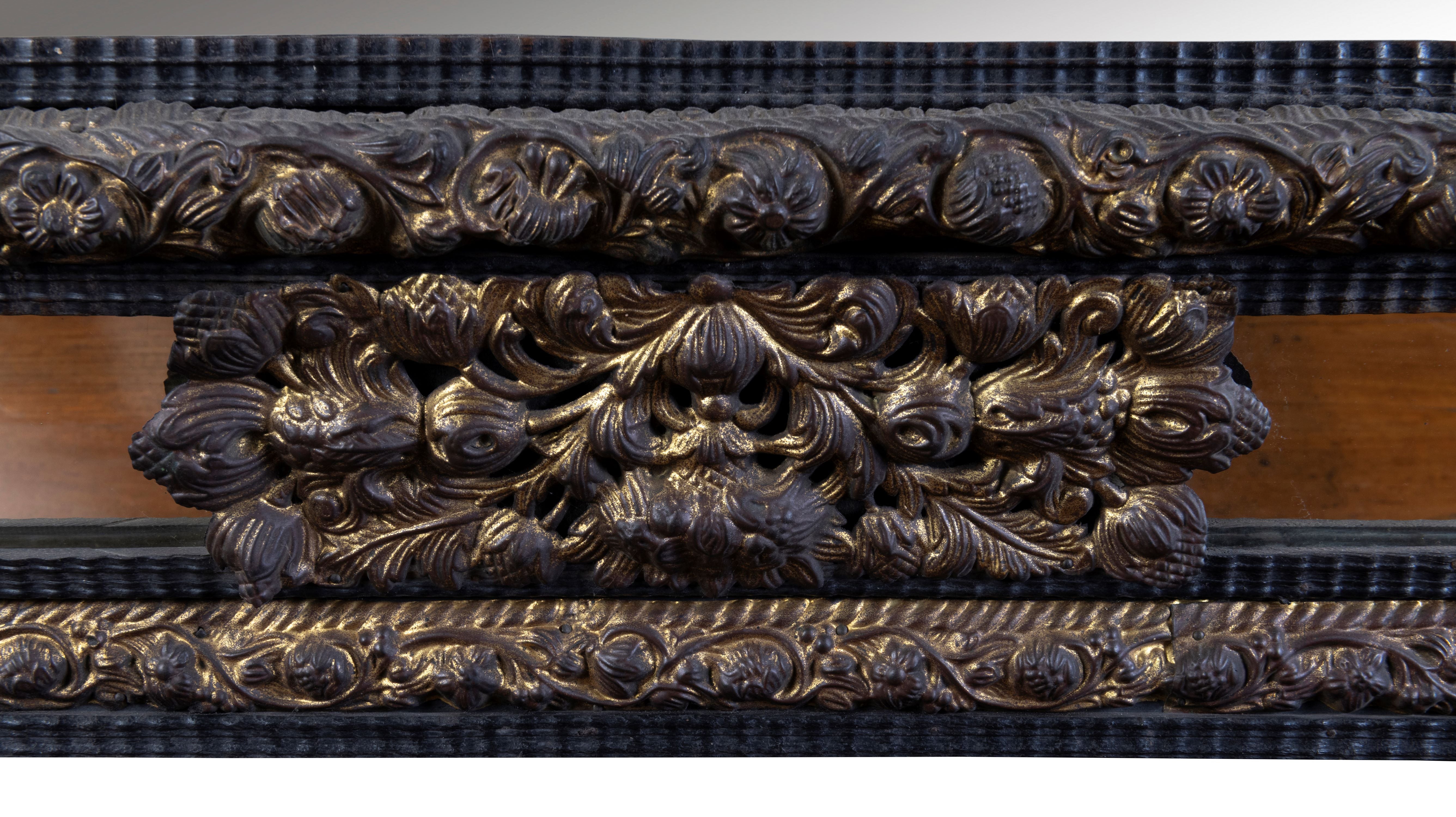 A 19th Century Flemish Embossed Brass and Ebonised Cushion Fronted Mirror (GS 387)