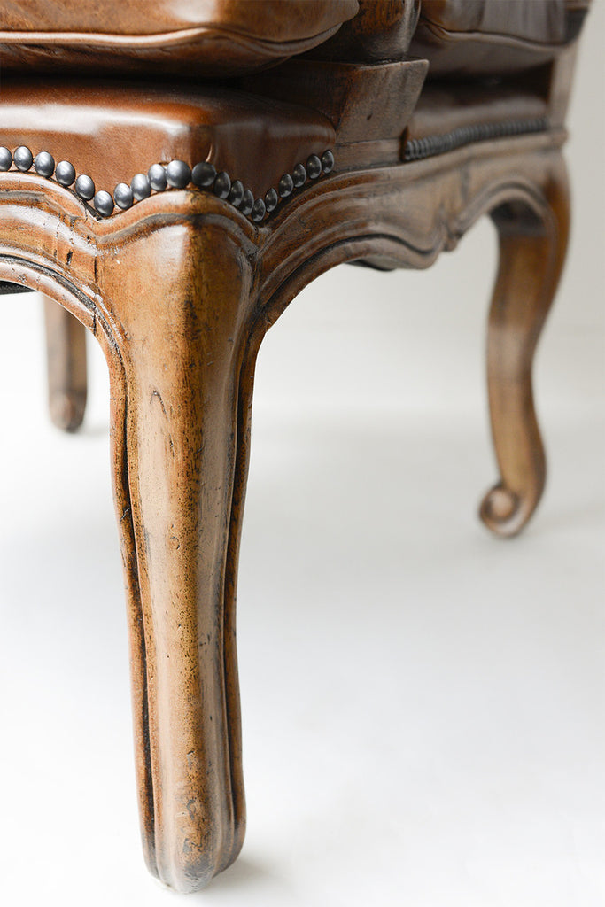 A French Leather Upholstered Walnut Framed Fauteuils