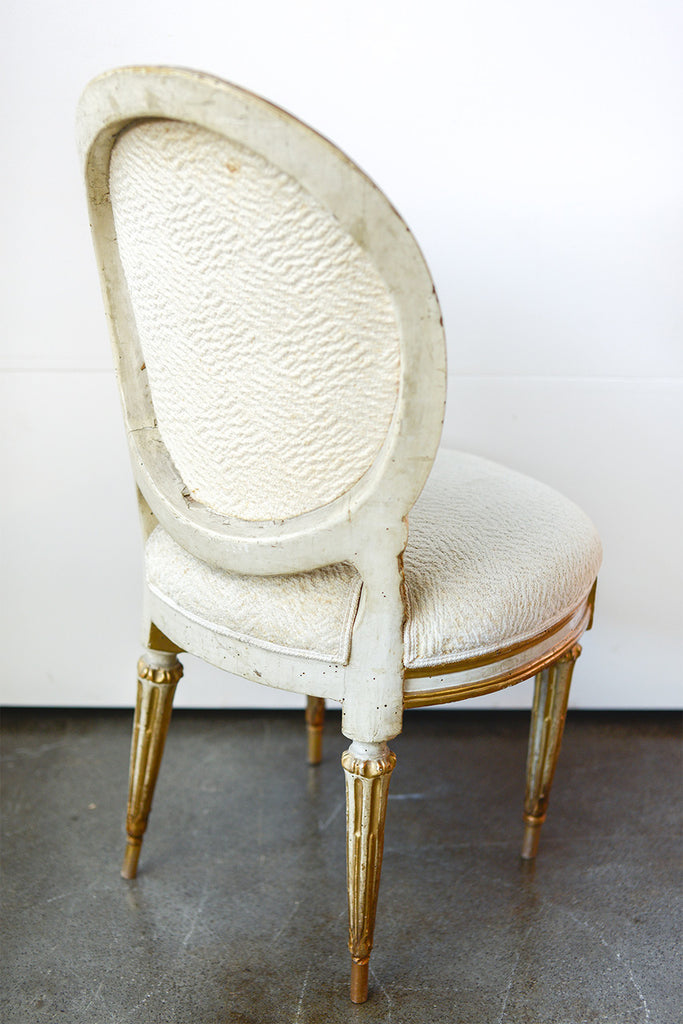 A Set of Twelve Antique Italian Louis XVI Painted and Parcel Gilt Dining Chairs