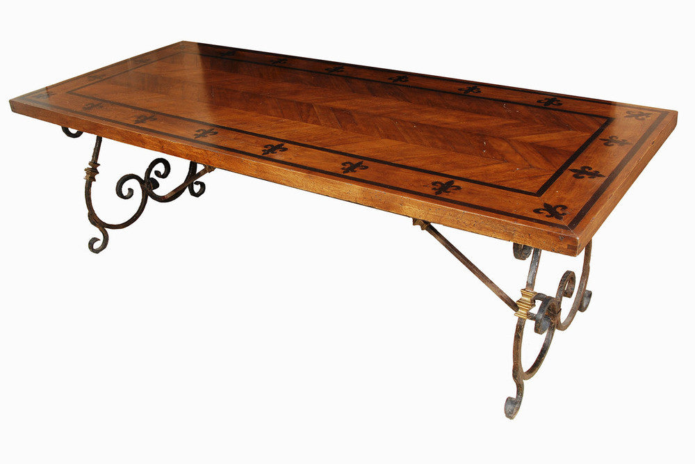 A Spanish Style Herringbone and Fleur de Lis Table on Iron Base