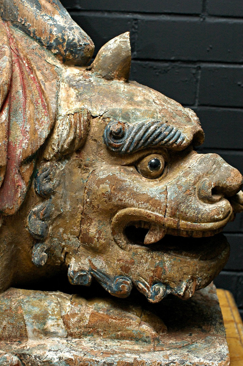 A Carved Wooden Figure of Guanyin Riding a Lion, Late Ming/early Qing period