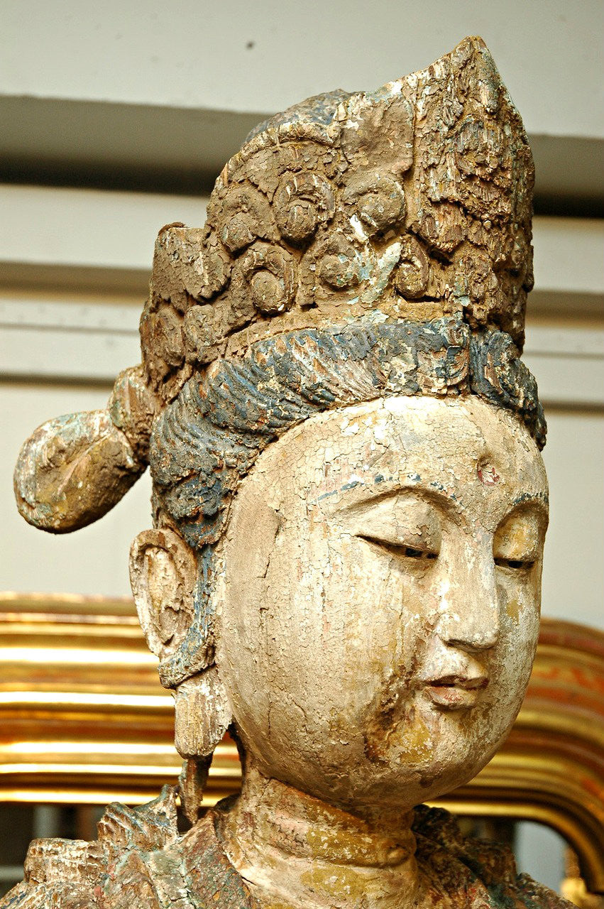 A Chinese Carved Wood Figure of Guanyin Riding a Lion, Late Ming/Early Qing Dynasty