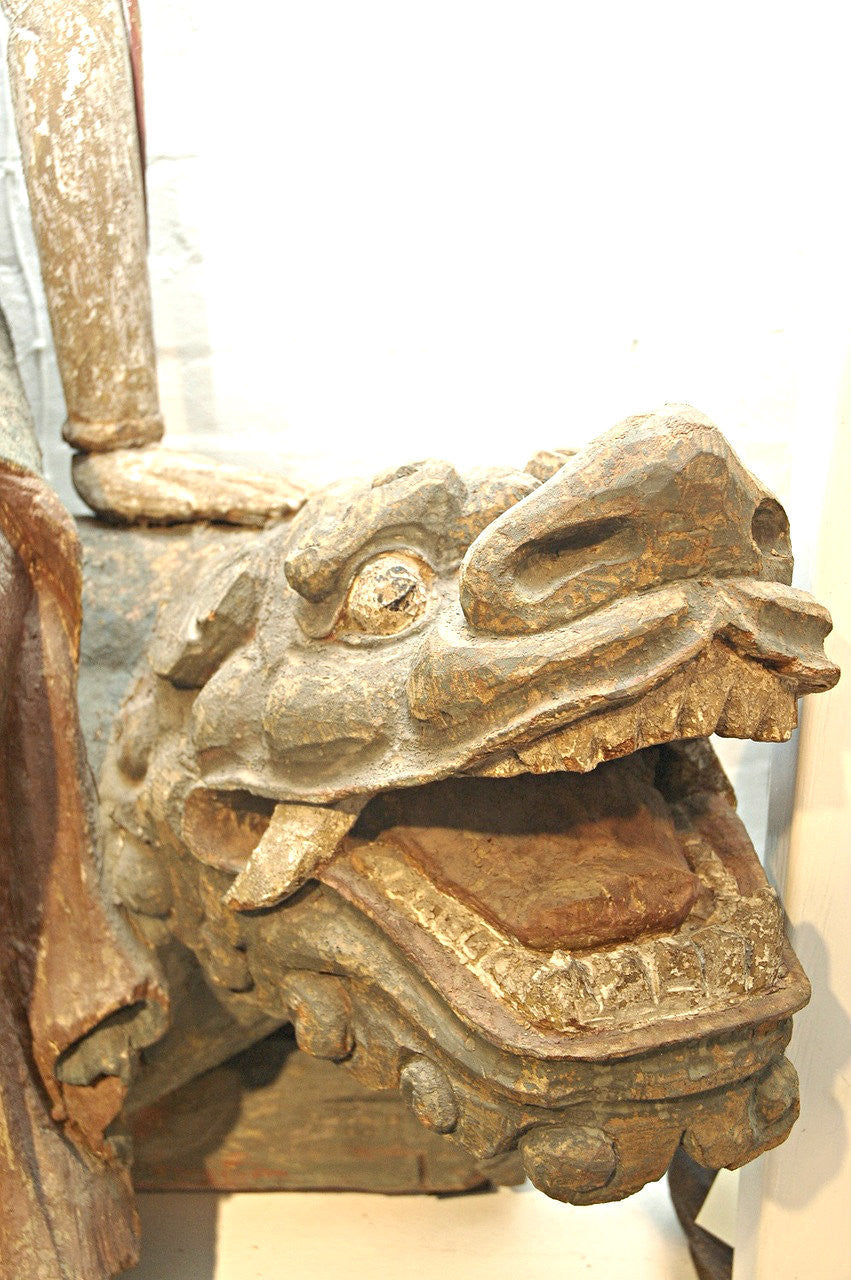 A Chinese Carved Wood Figure of Guanyin Riding a Lion, Ming Dynasty (1368-1644)