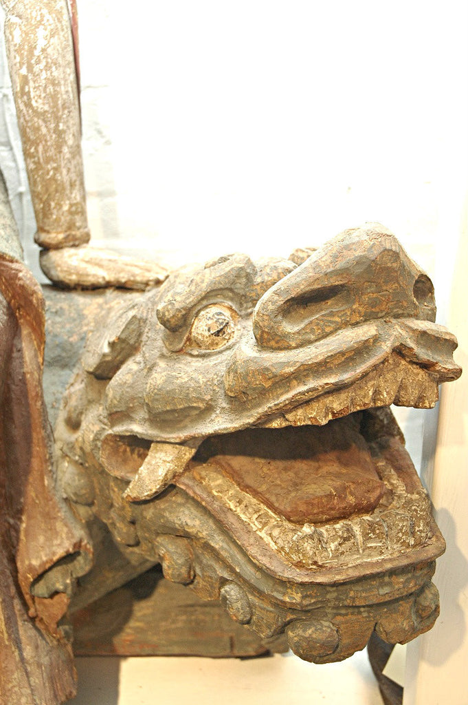 A Chinese Carved Wood Figure of Guanyin Riding a Lion, Ming Dynasty (1368-1644)