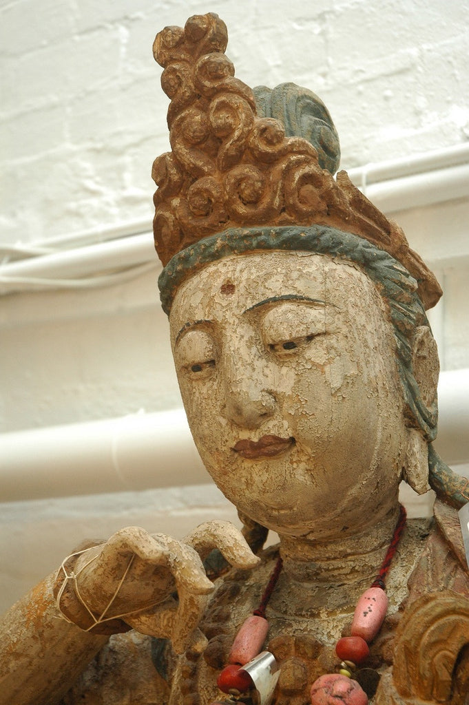 A Chinese Carved Wood Figure of Guanyin Riding a Lion, Ming Dynasty (1368-1644)