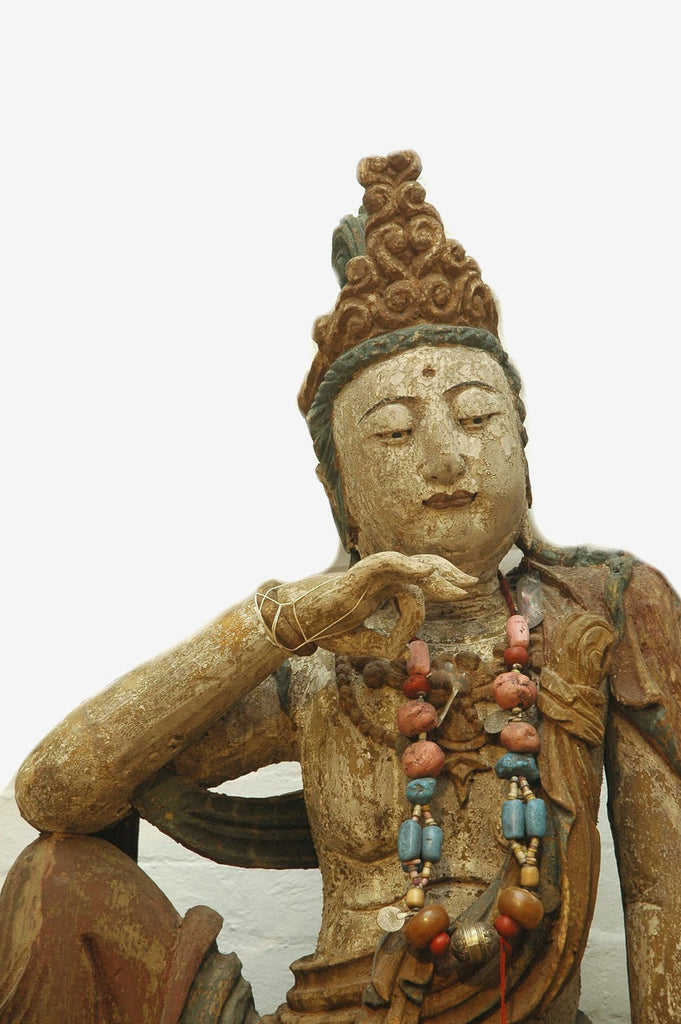 A Chinese Carved Wood Figure of Guanyin Riding a Lion, Ming Dynasty (1368-1644)