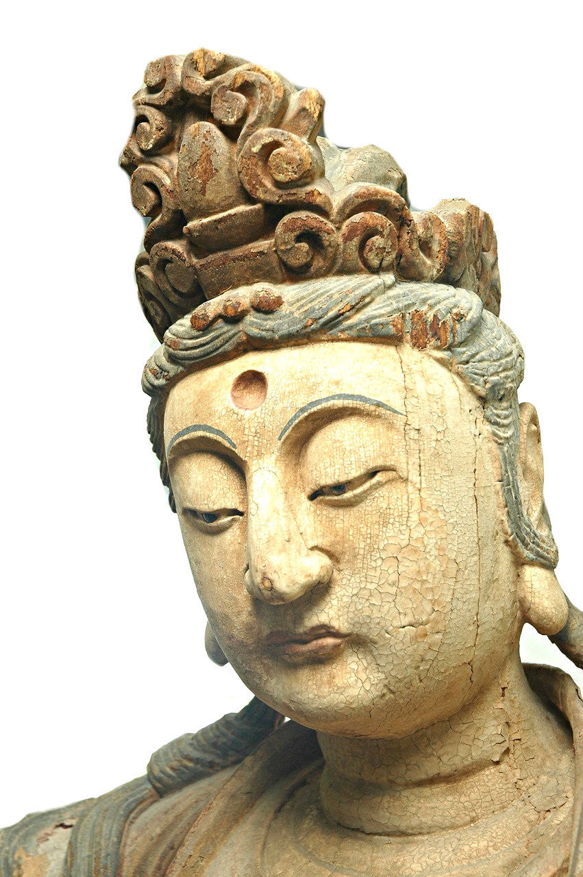 A Chinese Carved Wood Figure of Guanyin Riding a Qilin, Ming Dynasty (1368-1644)