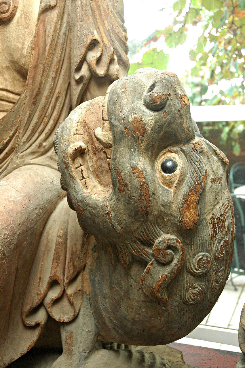 A Chinese Carved Wood Figure of Guanyin Riding a Qilin, Ming Dynasty (1368-1644)