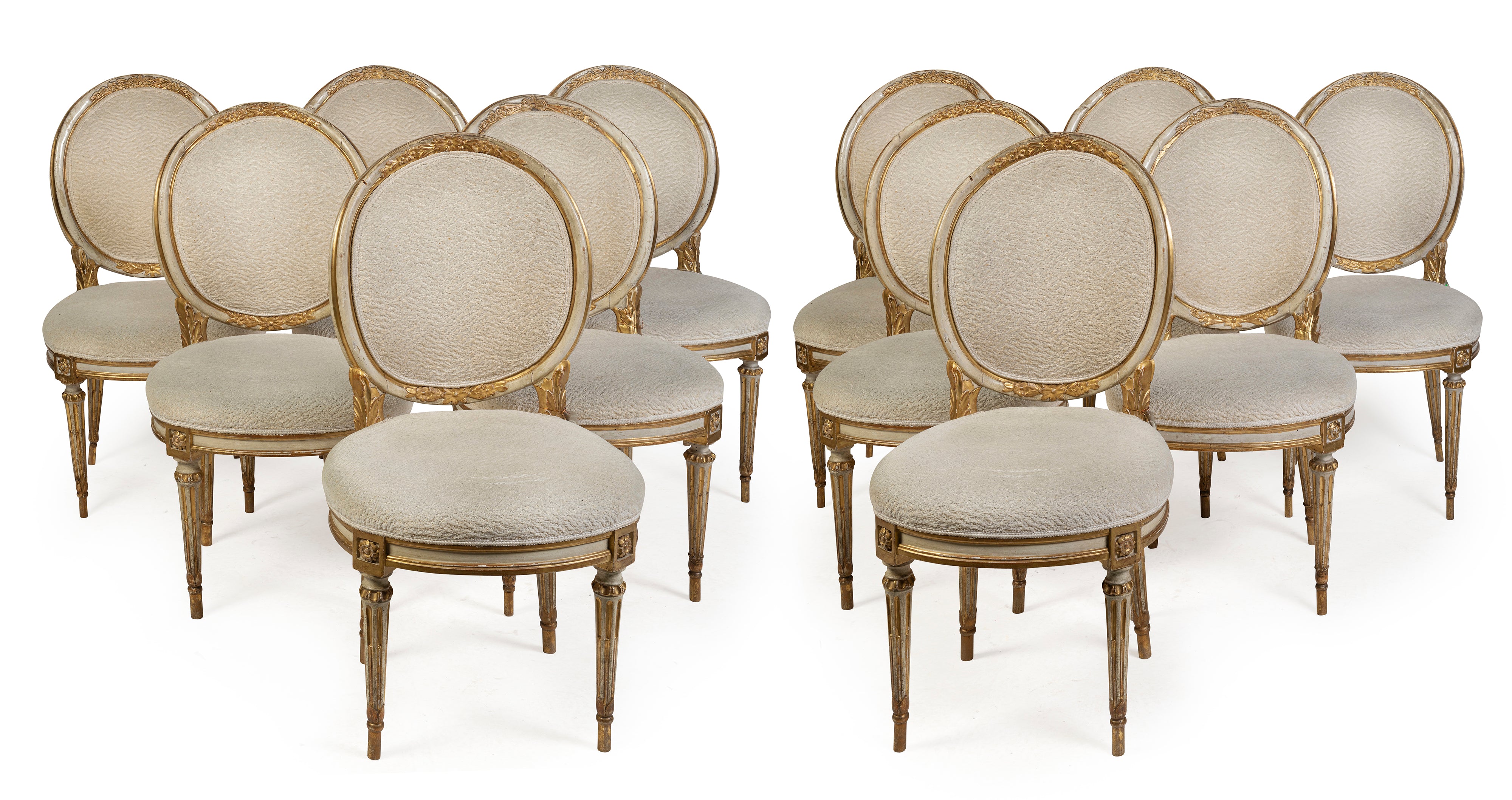 A Set of Twelve Antique Italian Louis XVI Painted and Parcel Gilt Dining Chairs
