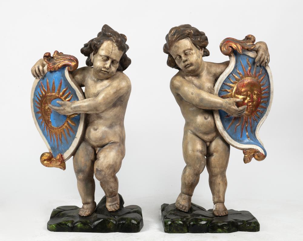 A Group of Four Baroque Style Polychrome Putto