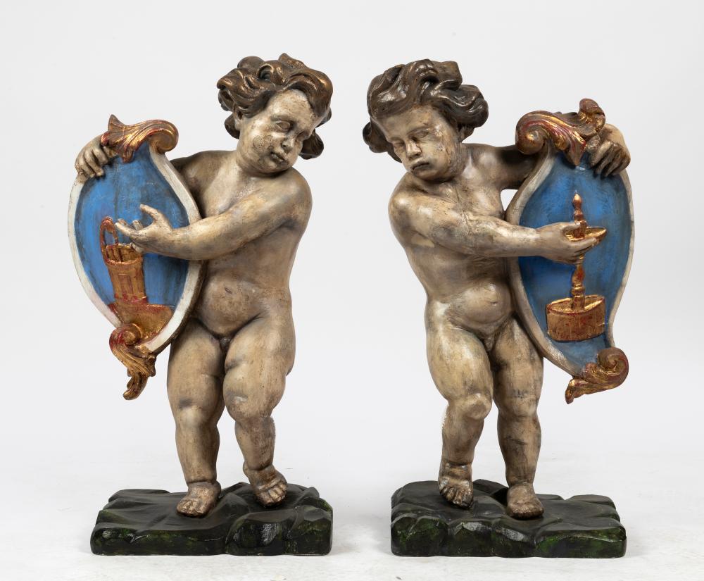 A Group of Four Baroque Style Polychrome Putto