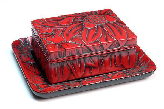 A Japanese Red Lacquered Lidded Box and Tray