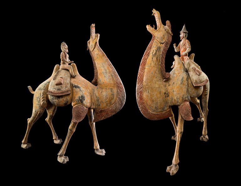 A Pair of Tang Dynasty Chinese Terracotta Bactrian Camels with Riders