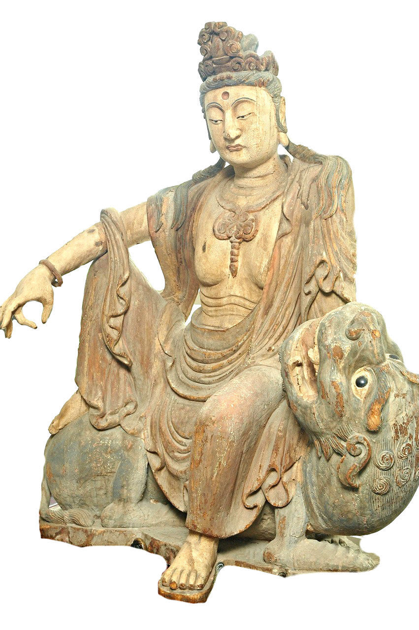 A Chinese Carved Wood Figure of Guanyin Riding a Qilin, Ming Dynasty (1368-1644)