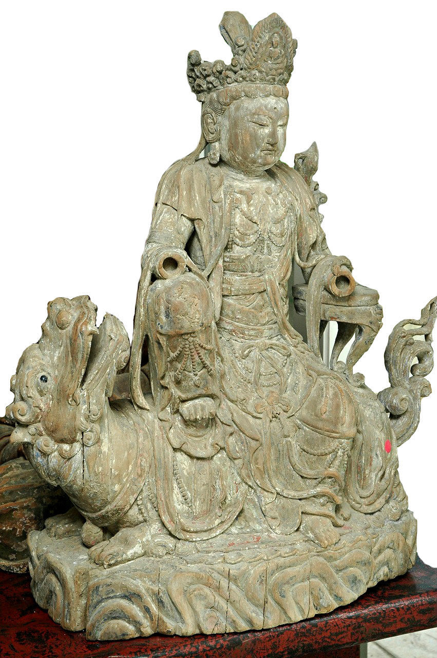 A Chinese Carved Wood Figure of Guanyin Riding a Qilin, Late Ming Dynasty (1368-1644)